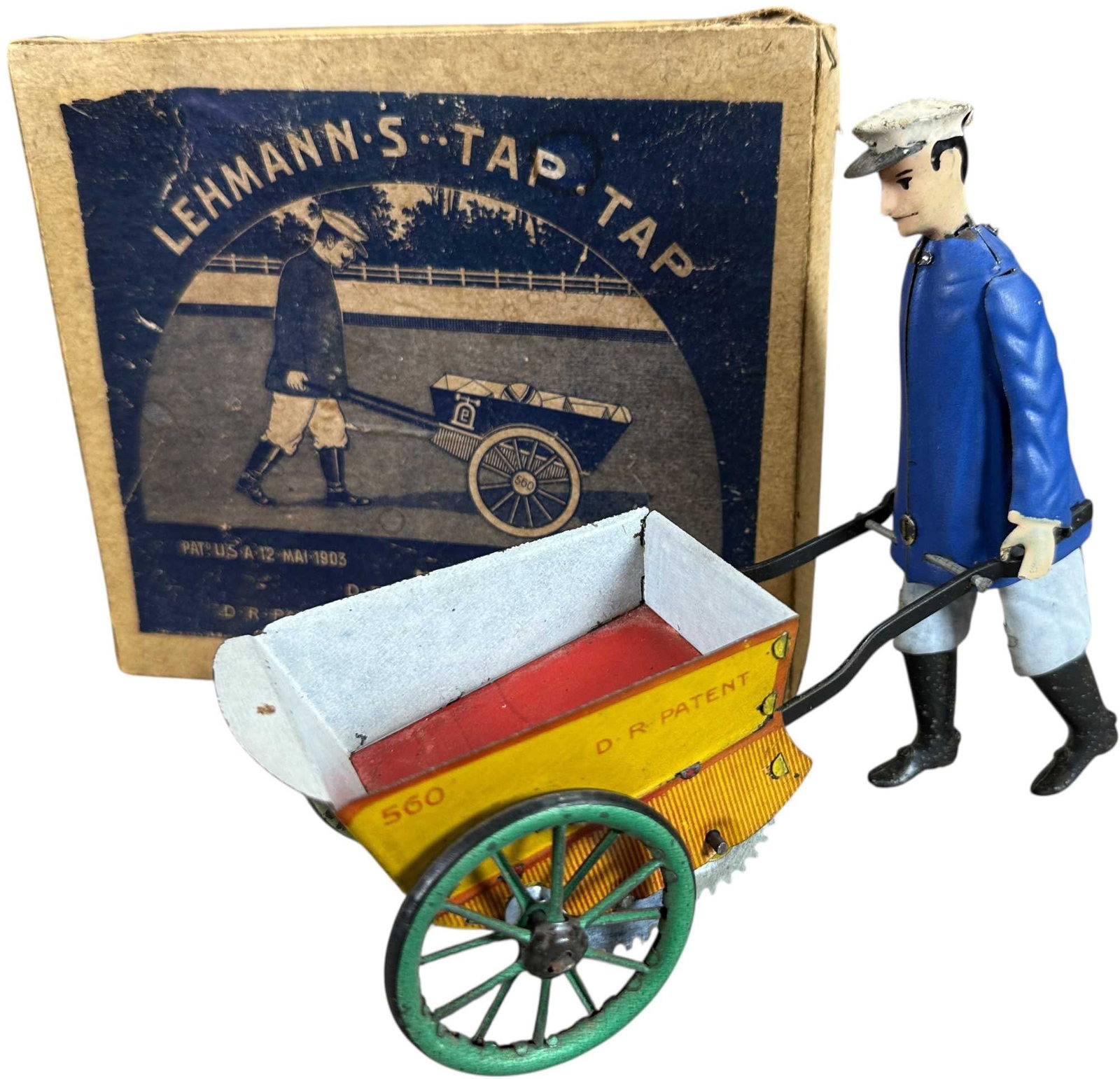 BOXED TAP TAP: 300. BOXED TAP TAP | Germany, wind-up mechanism, a colorful and crisp example. | 6.5" l. | Very slight tears to lid flaps as expected given age, toy is (Pristine Condition) | $700 - $1,100