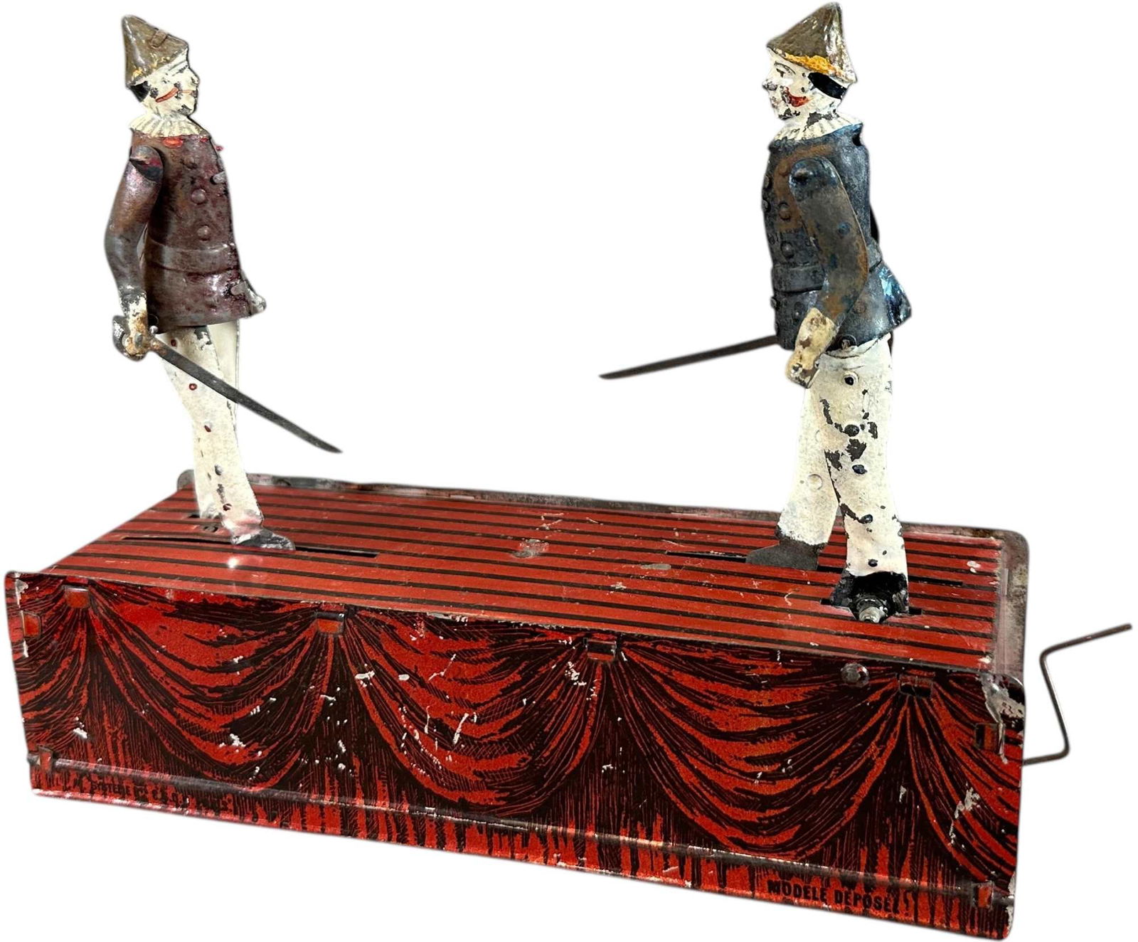 FERNAND MARTIN FAMOUS DUELLISTS: 308. FERNAND MARTIN FAMOUS DUELLISTS | France, circa 1887, early hand-wound rubber band motion, "Les Fameux duellistes," very rare toy, when activated the duelists' body and arms swing forward and bac