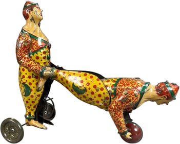 FRENCH CLOWN PUSHING CLOWN ON BALL