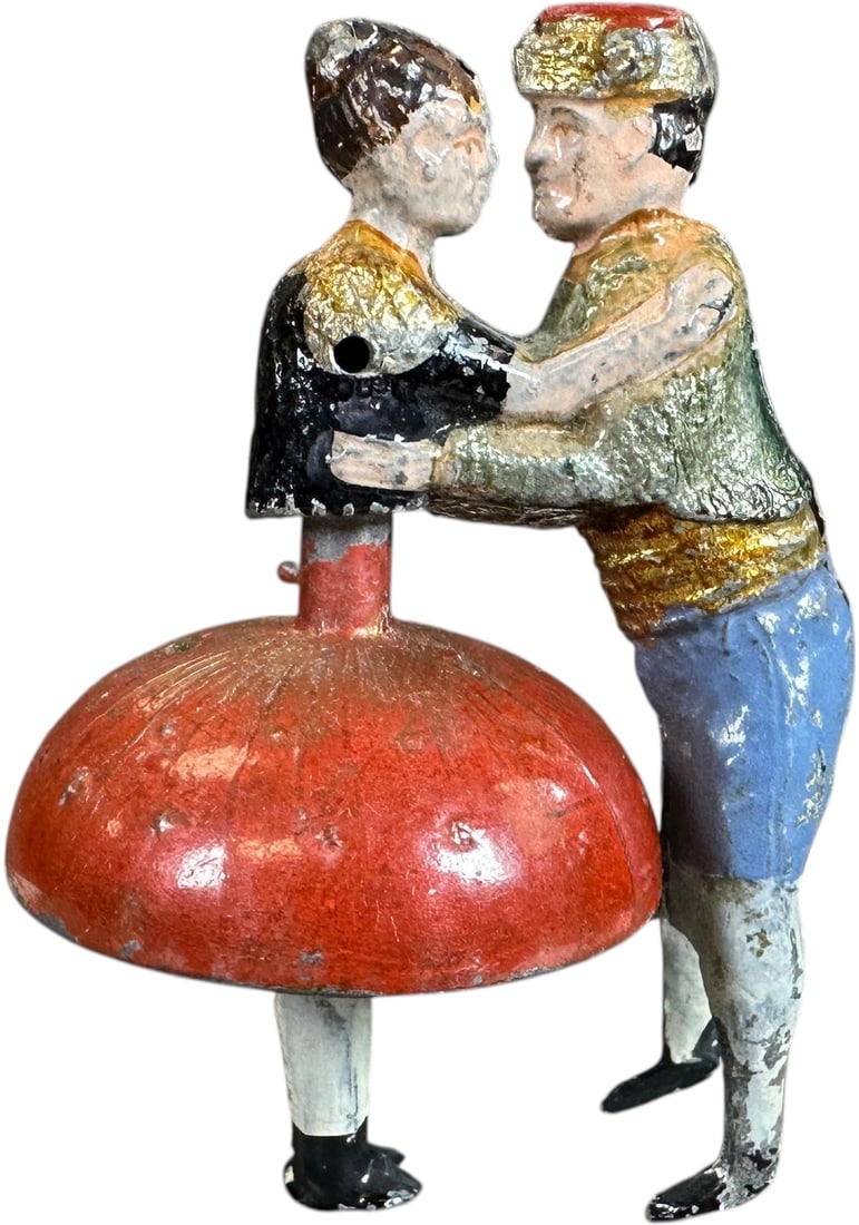 FERNAND MARTIN DANCING COUPLE TOP TOY: 349. FERNAND MARTIN DANCING COUPLE TOP TOY | France, circa 1885, gyro is activated with by wrapping and pulling a string, "Les Valseurs," hand and spirit painted lead, the couple dances as the man see