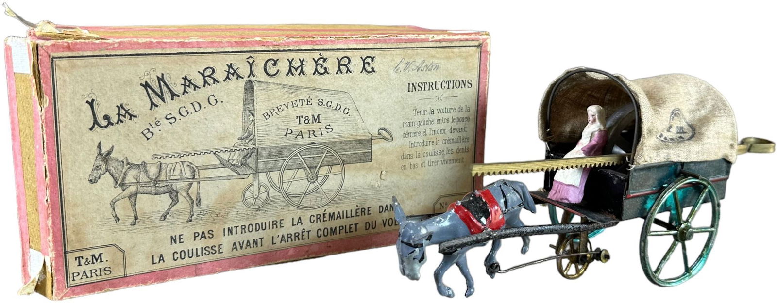 T&M PARIS HORSE DRAWN VEGETABLE VENDOR: 356. T&M PARIS HORSE DRAWN VEGETABLE VENDOR | France, circa 1910, flywheel gyro driven, "La Maraichere," early toy features original pull cord to engage flywheel and propel cart forward, includes orig