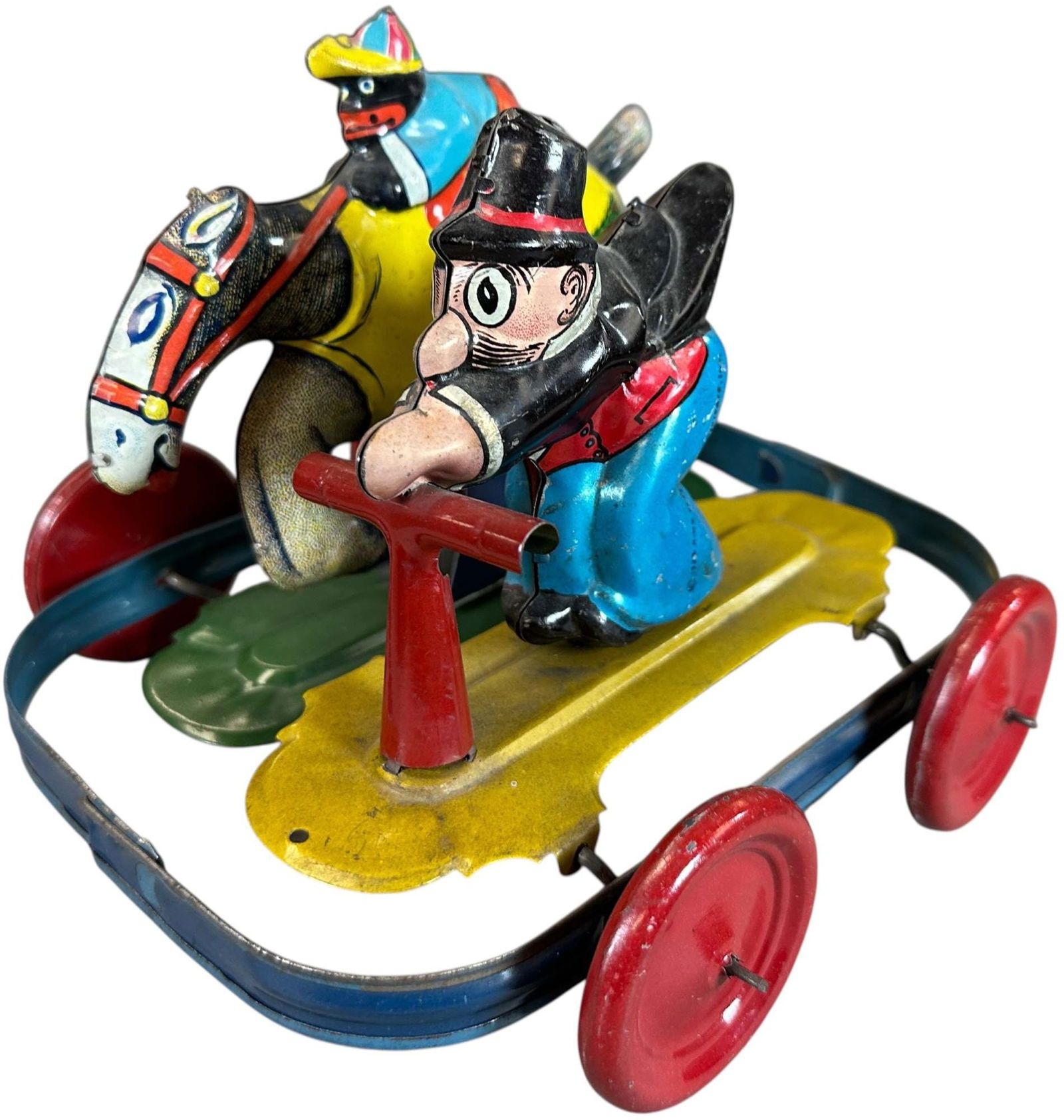 NIFTY BARNEY GOOGLE & SPARKPLUG PULL TOY: 365. NIFTY BARNEY GOOGLE & SPARKPLUG PULL TOY | Germany for American market. Pull toy, when rolled has figures moving up and down and forward back as if in a head to head race. Provenance: Donald Kauf