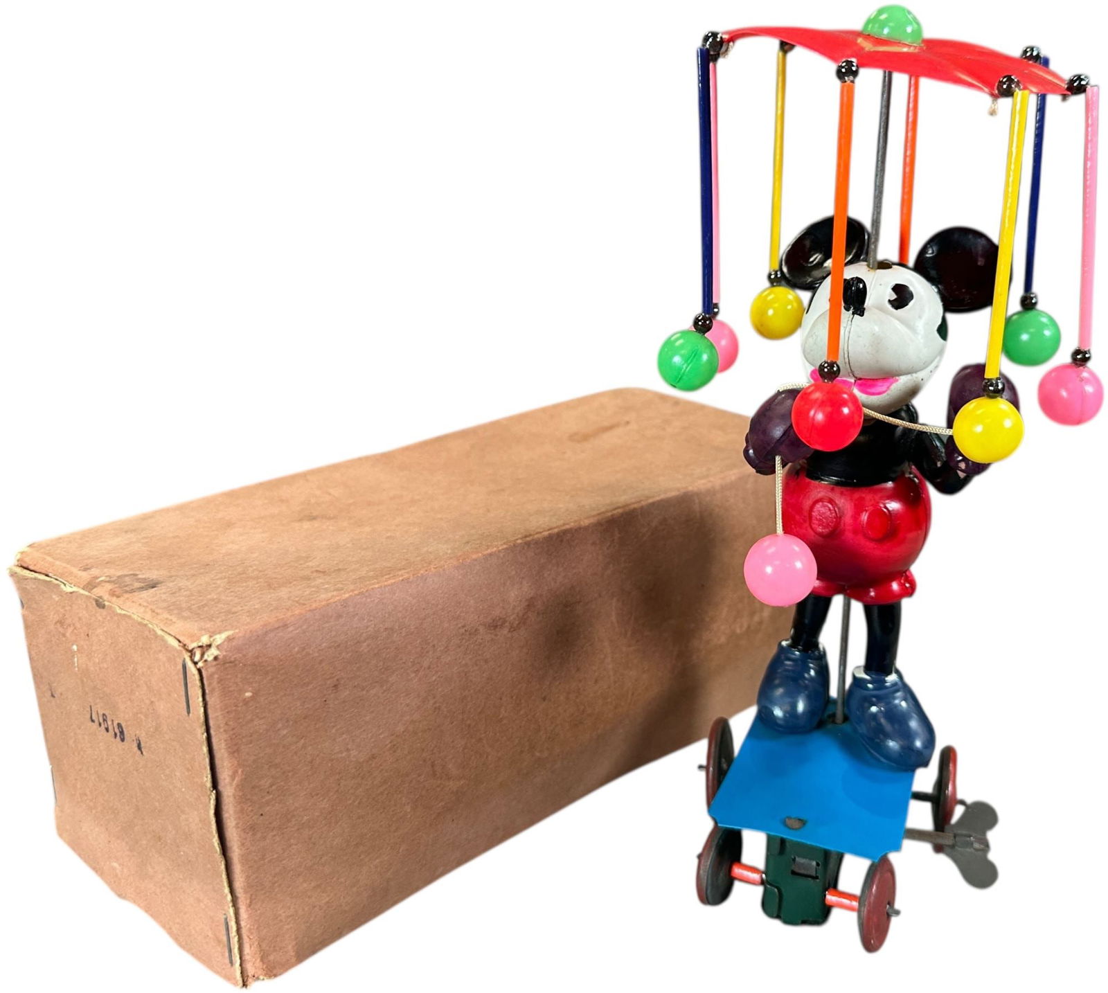 BOXED MICKEY MOUSE WHIRLYGIG: 376. BOXED MICKEY MOUSE WHIRLYGIG | Japan, c. 1930s, wind-up mechanism causes Mickey to merrily drive around in a circular motion, a charming and highly desirable pre-war Disney character toy, with or