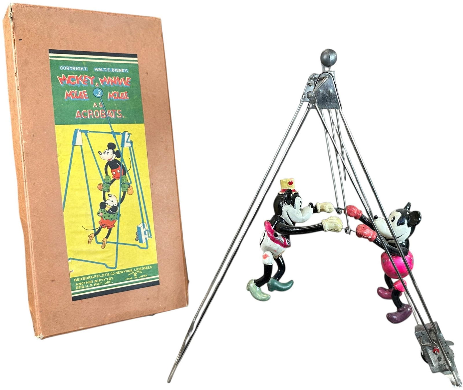 BOXED CELLULOID MICKEY & MINNIE ACROBATS: 377. BOXED CELLULOID MICKEY & MINNIE ACROBATS | Geo. Borgfeldt & Co., NY Provenance: Richard Mueller Collection. | 12.5" h. | Minor denting to celluloid, (Pristine Condition) | $500 - $800