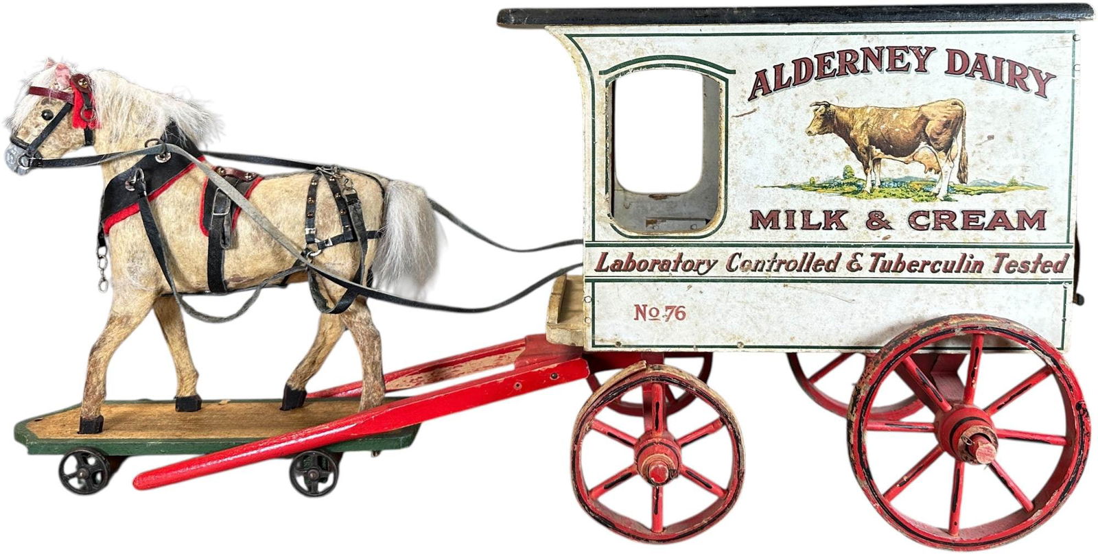 SCHOENHUT ALDERNEY DAIRY WAGON: 1144. SCHOENHUT ALDERNEY DAIRY WAGON | Wonderful graphics on sides of original wooden "Alderney Dairy" wagon, one of the popular series of Philadelphia produced dairy wagons. Provenance: Richard Muell