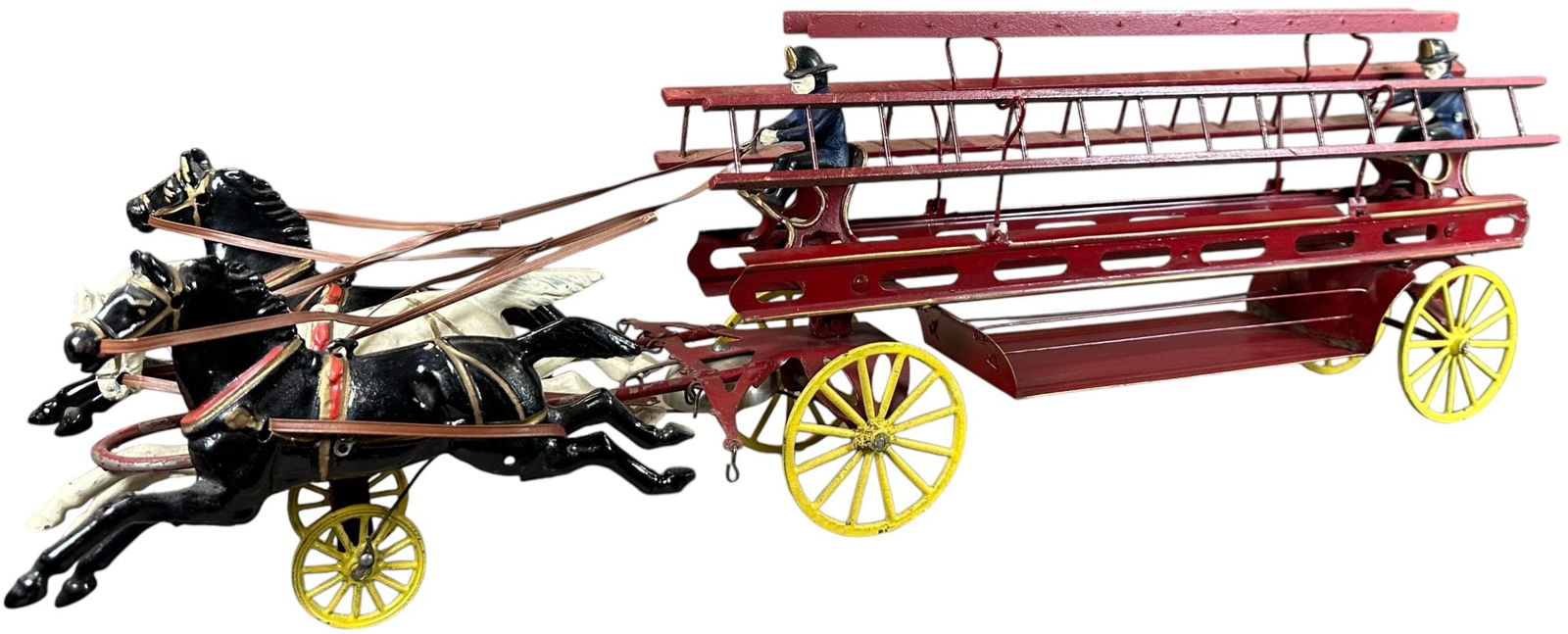 WILKINS HORSE DRAWN LADDER WAGON: 1182. WILKINS HORSE DRAWN LADDER WAGON | Produced around the transitional Kingsbury/Wilkins period, the red wagon portion is made of sheet metal while the remainder of the toy is cast iron, this is a