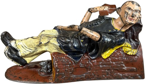 RECLINING CHINAMAN MECHANICAL BANK