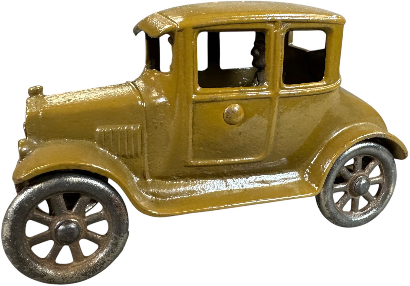 KILGORE COUPE WITH SPRING DRIVER: 1271. KILGORE COUPE WITH SPRING DRIVER | Scarce color. Provenance: David Bausch Collection. | 6" l. | Oxidation to wheels need scrubbing, passenger figure is absent, paint in overall (Near Mint Condit