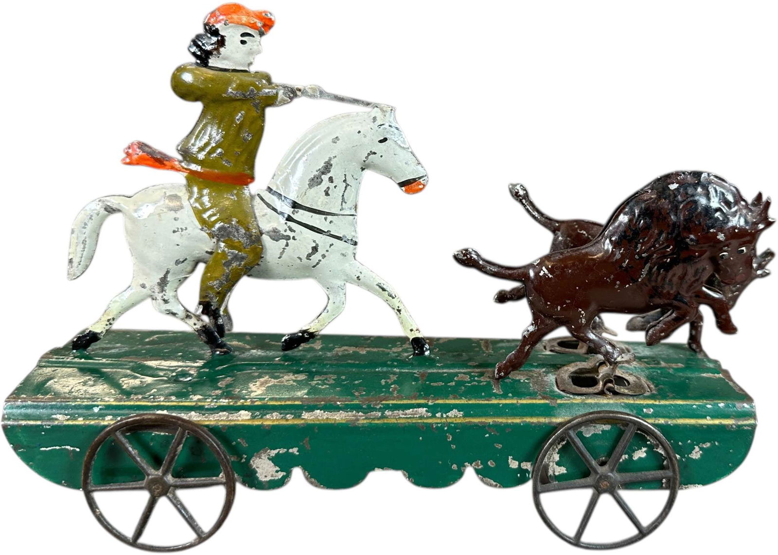 FALLOWS AMERICAN BUFFALO BILL PULL TOY: 1292. FALLOWS AMERICAN BUFFALO BILL PULL TOY | As the toy rolls, two buffalos rock back and forth as if fleeing the rifle of horse mounted Buffalo Bill. Provenance: Richard Mueller Collection. | 9" l.