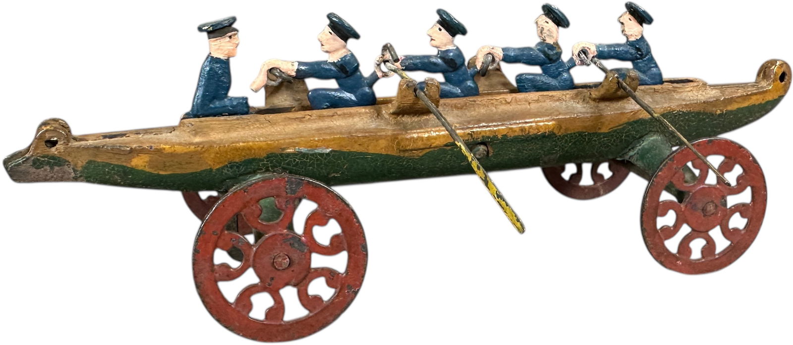 US HARDWARE RACING SCULL: 1305. US HARDWARE RACING SCULL | Scarce smallest size example, blue sailor variation, Pat. 1893 on side, used as floor pull toy, as toy rolls, the oarsmen simulate rowing by moving back and forth. Pro