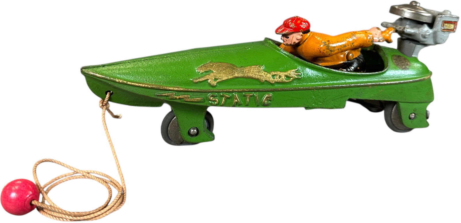 HUBLEY STATIC SPEED BOAT: 1306. HUBLEY STATIC SPEED BOAT | Open air rear end version with a fixed prop cast engine, bright colors and minimal handling wear make this an extraordinary cast iron pull toy! | 10" l. | Flat spot to