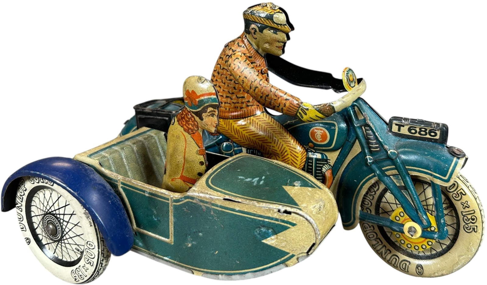 TIPPCO TOURING CYCLE W/SIDECAR: 63. TIPPCO TOURING CYCLE W/SIDECAR | Germany, wind-up motor. | Provenance: The Maloy Collection. | 8" l. | Complete and all original, (Excellent Condition) | $700 - $1,300