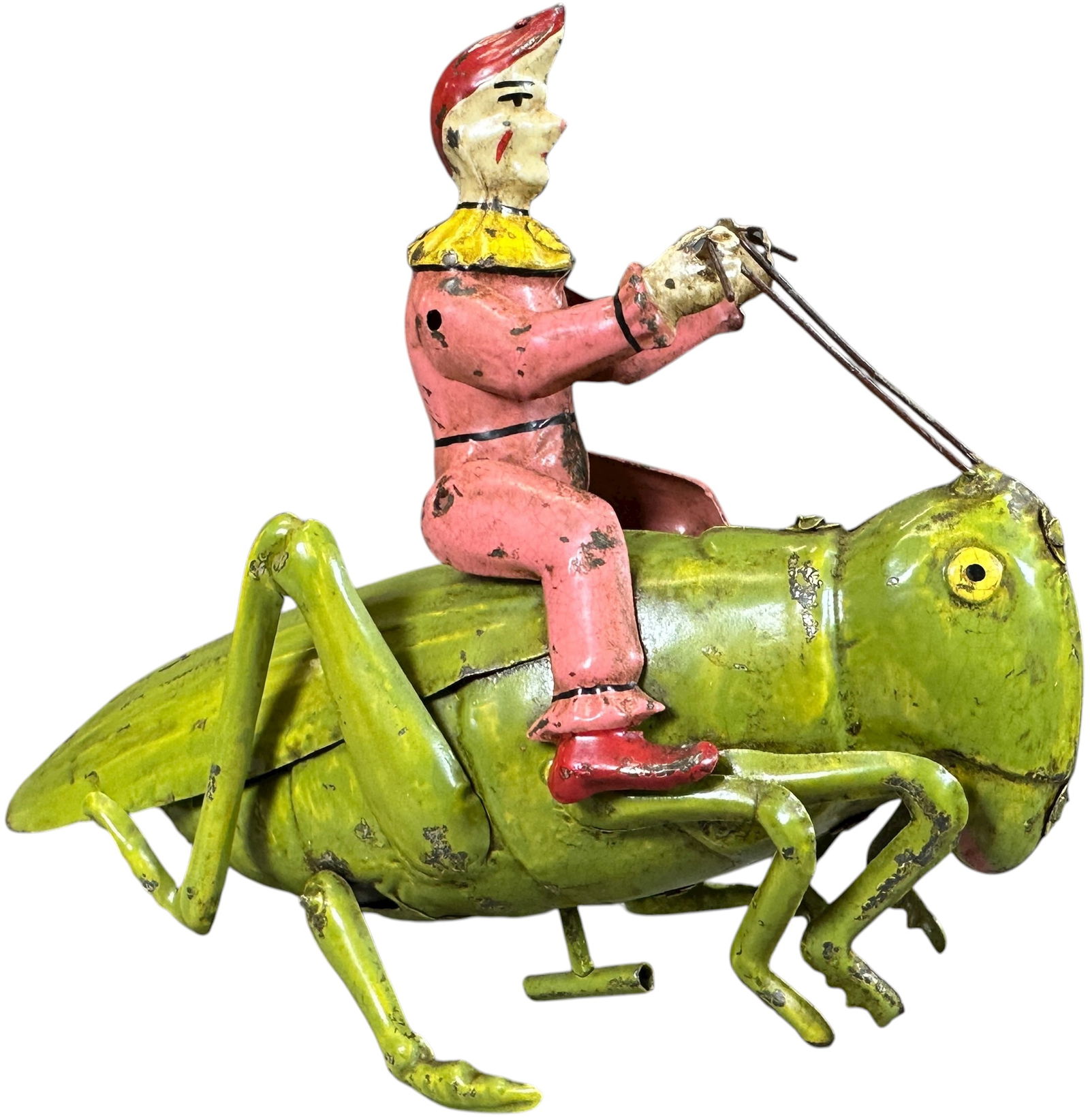 HANS EBERL CLOWN RIDING GRASSHOPPER: 113. HANS EBERL CLOWN RIDING GRASSHOPPER | Germany, wind-up motor causes a gravity fed hopping motion, a very cute and whimsical toy. | Provenance: The Maloy Collection. | 8" l. | Toy is professionall