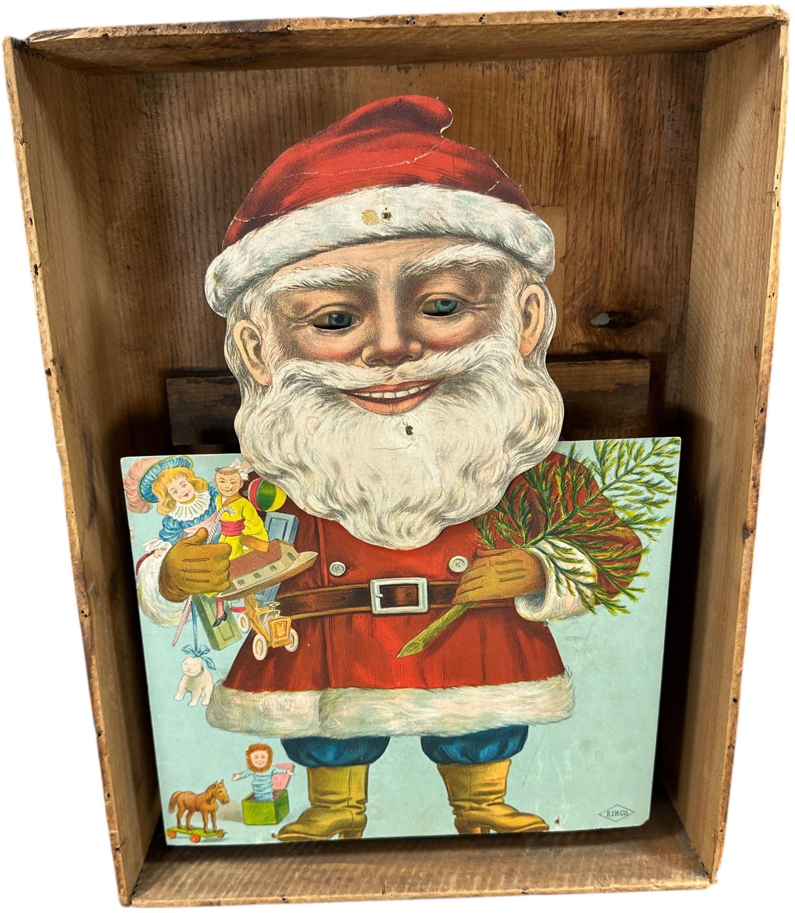 SANTA CLAUS CLOCKWORK TRADE STIMULATOR: 29. SANTA CLAUS CLOCKWORK TRADE STIMULATOR | Very seldom found in original wooden crate, E.I. Horsman Co. When wound, Santa nods his head from side to side as his eyes roll around over his rosy