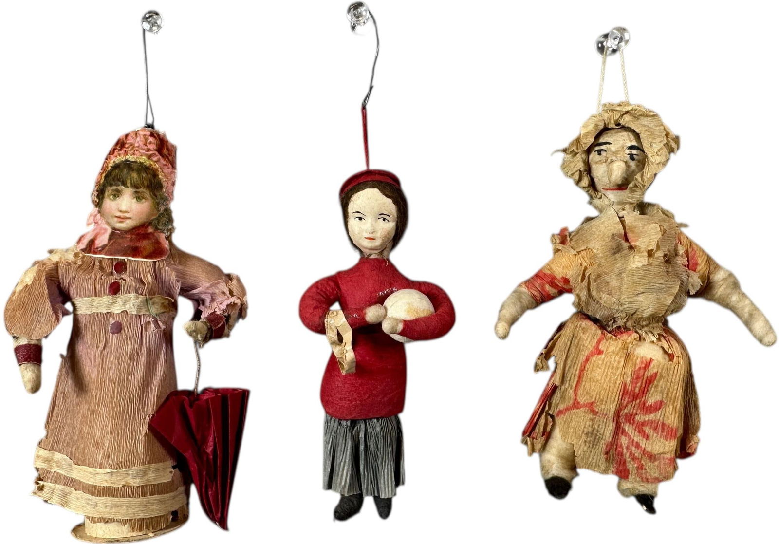 THREE GIRL COTTON ORNAMENTS: 40. THREE GIRL COTTON ORNAMENTS | Scrap face, compo head, cotton head with large nose. Provenance: Jerry & Darla Arnold Collection. | 5" h. | (Excellent Condition) | $500 - $1,000