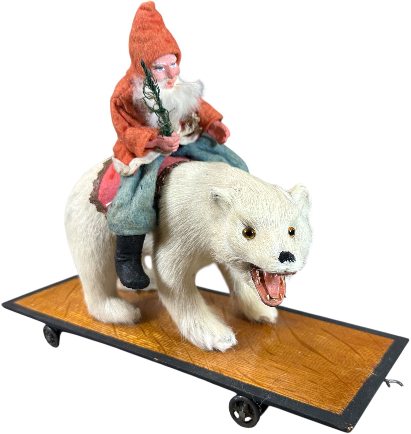 SANTA RIDING A POLAR BEAR: 55. SANTA RIDING A POLAR BEAR | Nice platform on wheels. Provenance: Ed & Brenda DeGarbolewski Collection. | 12" l. | (Pristine Condition) | $800 - $1,600