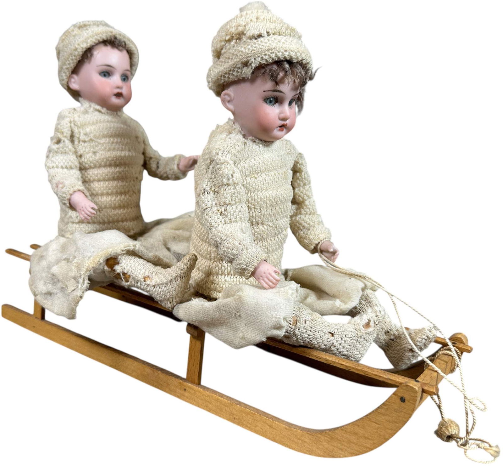 HEUBACH KIDS ON DOUBLE SLEIGH: 57. HEUBACH KIDS ON DOUBLE SLEIGH | Very fine Heubach heads, separates at sled. Provenance: Ed & Brenda DeGarbolewski Collection. | 11.5" l. | (Excellent Condition) | $1,200 - $2,000