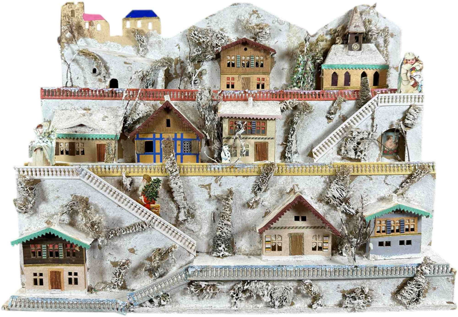 ELABORATE GERMAN PUTZ CANDLE HOUSE VILLAGE: 58. ELABORATE GERMAN PUTZ CANDLE HOUSE VILLAGE | German made candle house village. Provenance: Ed & Brenda DeGarbolewski Collection. | 16" l. | Embellished with scrap figures (Excellent Condition) |