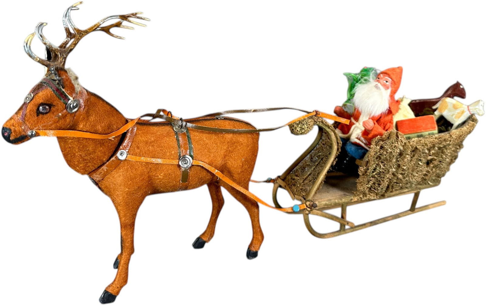 SANTA LOOFAH SLEIGH W/ REINDEER CONTAINER: 64. SANTA LOOFAH SLEIGH W/ REINDEER CONTAINER | A very sweet small size, reindeers head removes for candy container. | 14" l. | (Pristine Condition) | $1,500 - $2,500