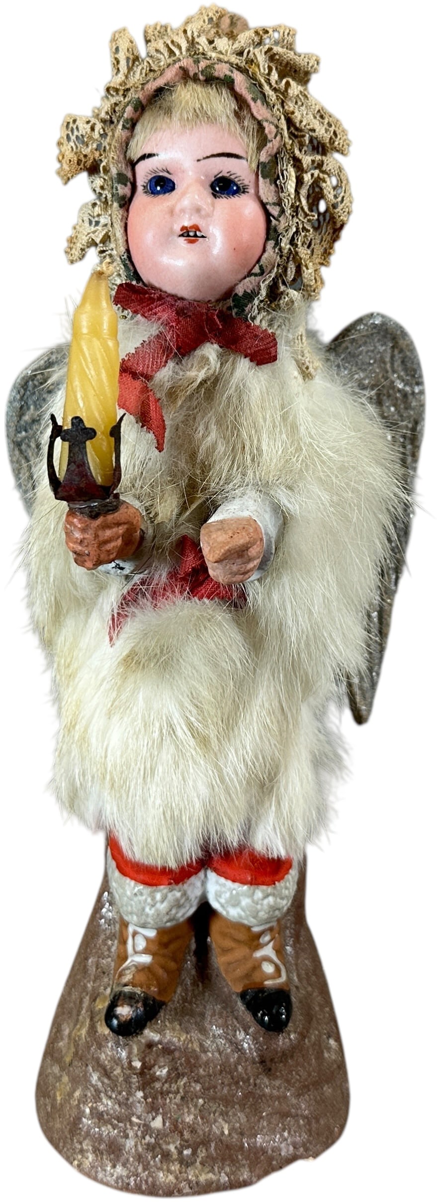 CHRIST CHILD ANGEL CANDY CONTAINER: 74. CHRIST CHILD ANGEL CANDY CONTAINER | Superb example, rabbit fur clothes, child separates in middle for candy storage, great detail at boots and pressed board wings! | 9.5" h. | Very small chip to