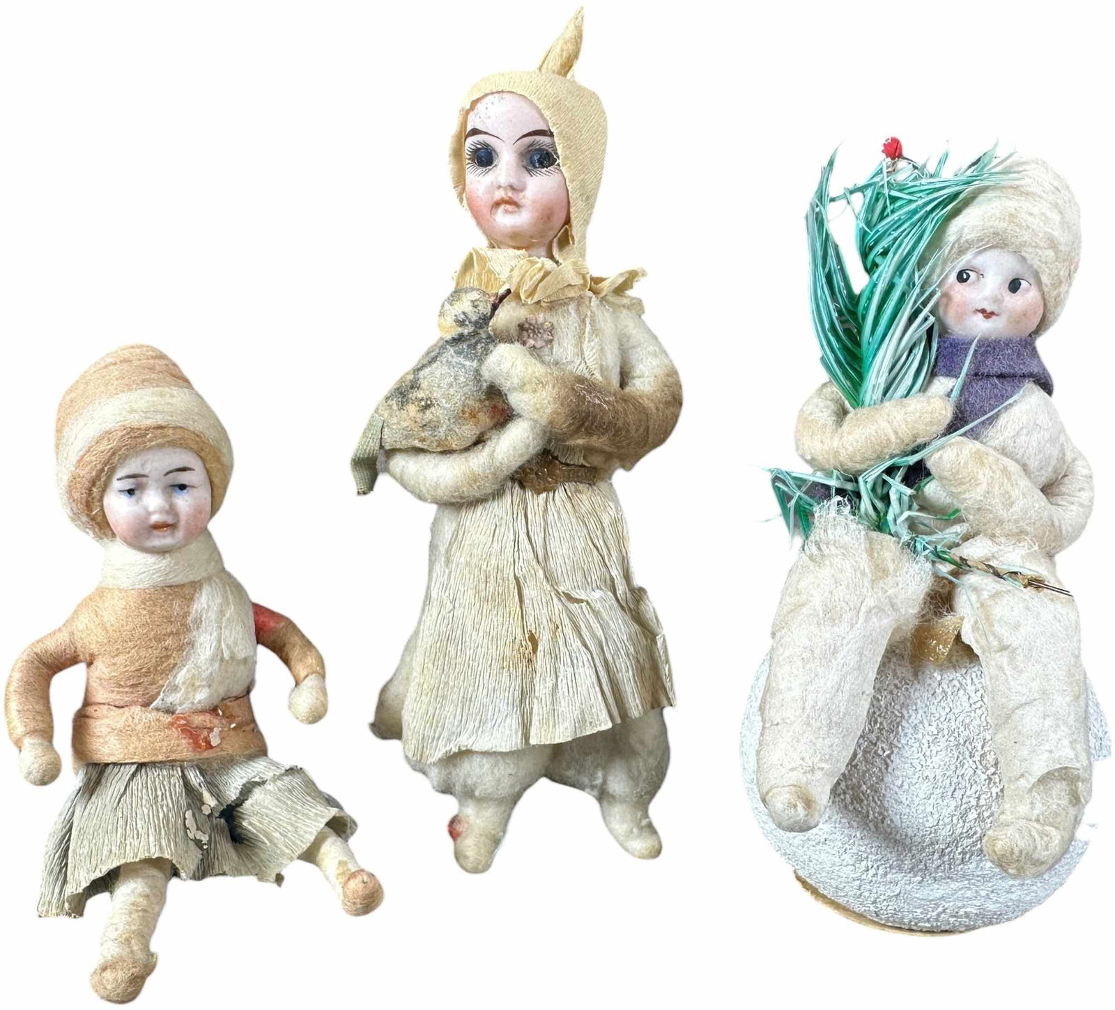 THREE BISQUE HEAD SNOW CHILDREN: 91. THREE BISQUE HEAD SNOW CHILDREN | One with glass eyes. Provenance: Bob & Maurine Young | 5" h. | (Excellent to Pristine Condition) | $500 - $1,000