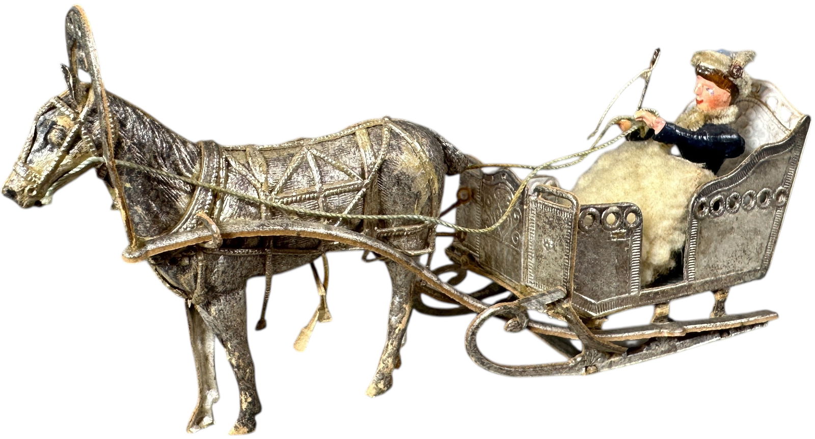 DRESDEN WOMAN IN SLEIGH ORNAMENT: 93. DRESDEN WOMAN IN SLEIGH ORNAMENT | One of the best Dresden ornaments ever produced, lovely woman and wonderful detail on all of the horse harnesses and sleigh. Provenance: Linda Morrow Collection