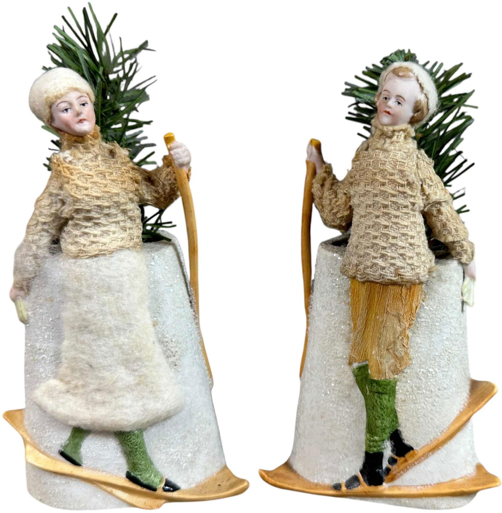 TWO WONDERFUL GERMAN BISQUE SKIERS: 110. TWO WONDERFUL GERMAN BISQUE SKIERS | Great delicate faces, cloth clothing. Provenance: Ed & Brenda DeGarbolewski Collection. | 6" h. | (Pristine Condition) | $400 - $800