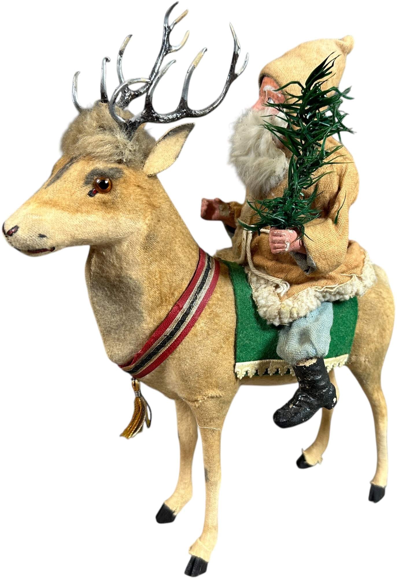 GERMAN SANTA ON REINDEER CANDY CONTAINER: 111. GERMAN SANTA ON REINDEER CANDY CONTAINER | Cute size. Provenance: Beth Karp Collection. | 10.5" h. | (Excellent Condition) | $1,500 - $3,000