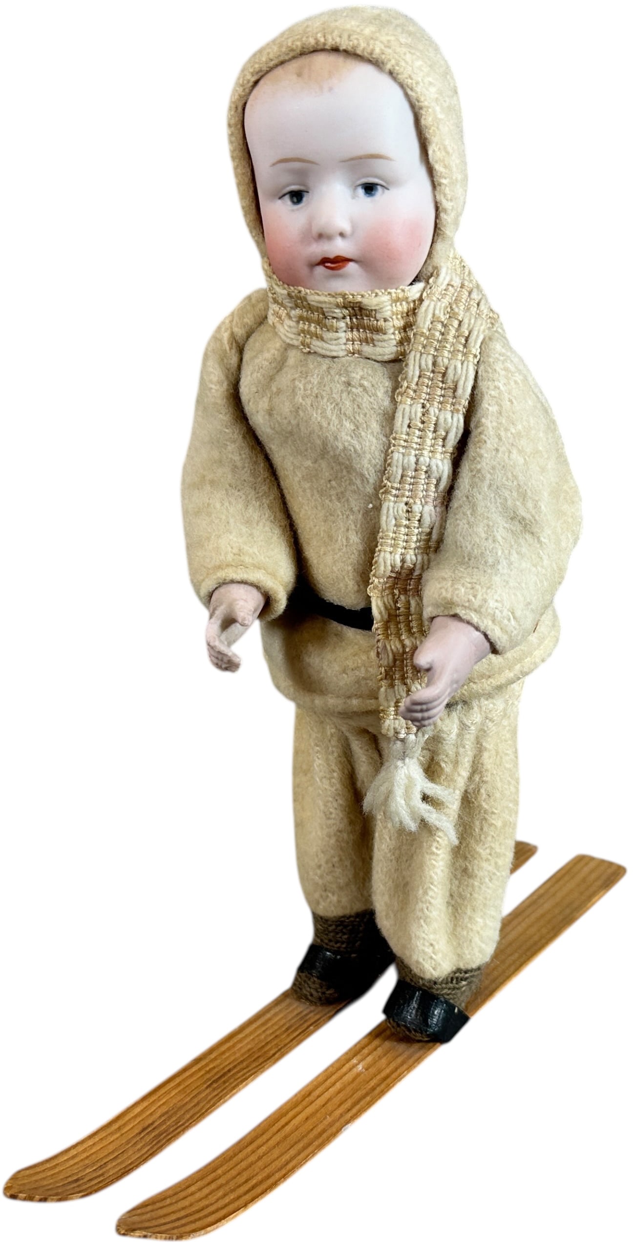 PORCELAIN HEAD SKIER CANDY CONTAINER: 122. PORCELAIN HEAD SKIER CANDY CONTAINER | Cute German skier container. Provenance: Ed & Brenda DeGarbolewski Collection. | 8.5" h. | One leg loose at hip, still stands up, (Excellent Condition) | $8