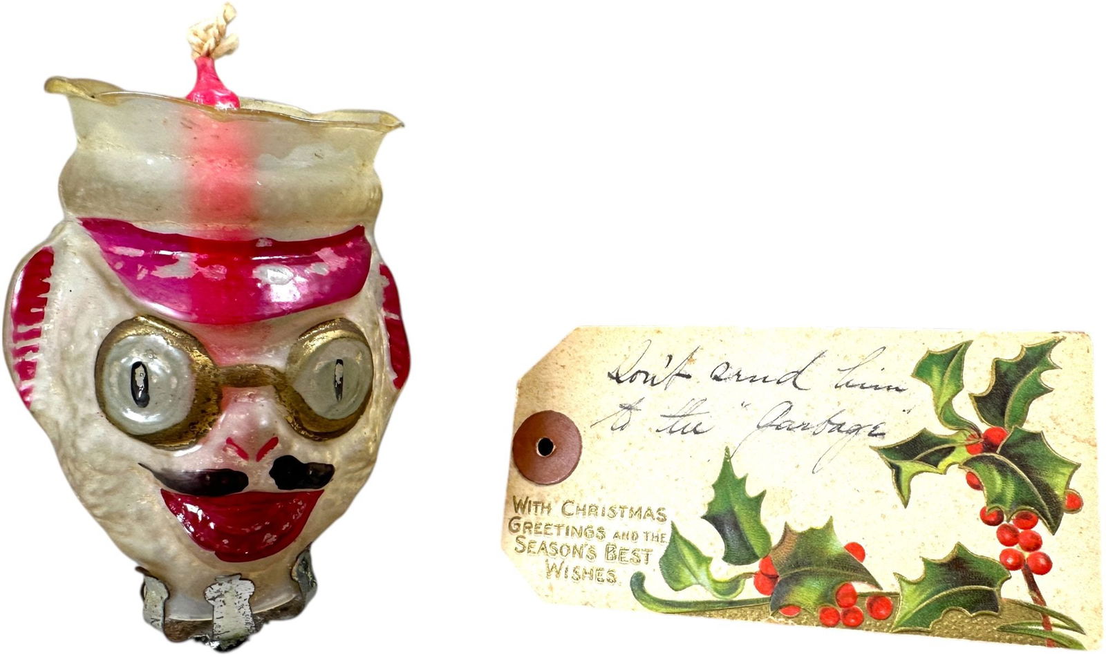 CHAUFFER HEAD GLASS CANDLE SHADE: 142. CHAUFFER HEAD GLASS CANDLE SHADE | Great early glass with Christmas tag. Provenance: David Bausch Collection. | 4" h. | (Pristine Condition) | $600 - $1,000