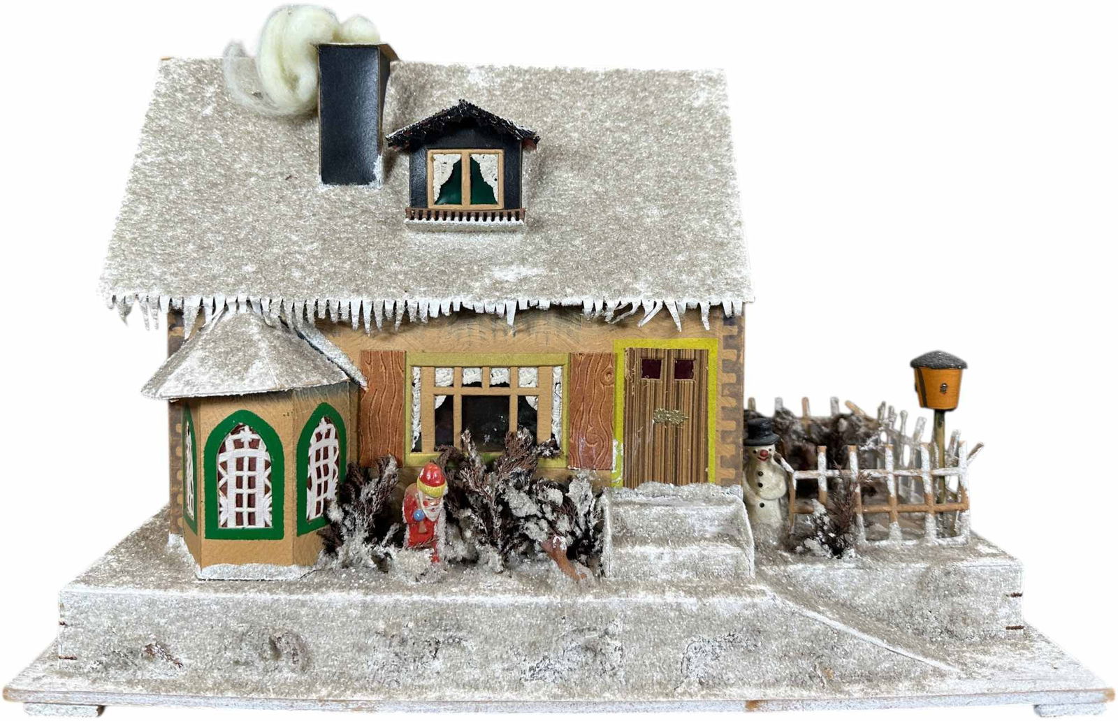 GERMAN PUTZ WINTER SNOWY HOUSE: 147. GERMAN PUTZ WINTER SNOWY HOUSE | Candles may be placed on the inside to light up the windows. Provenance: Bob & Maurine Young | 16 x 8 x 10" lwh. | (Excellent Condition) | $600 - $800