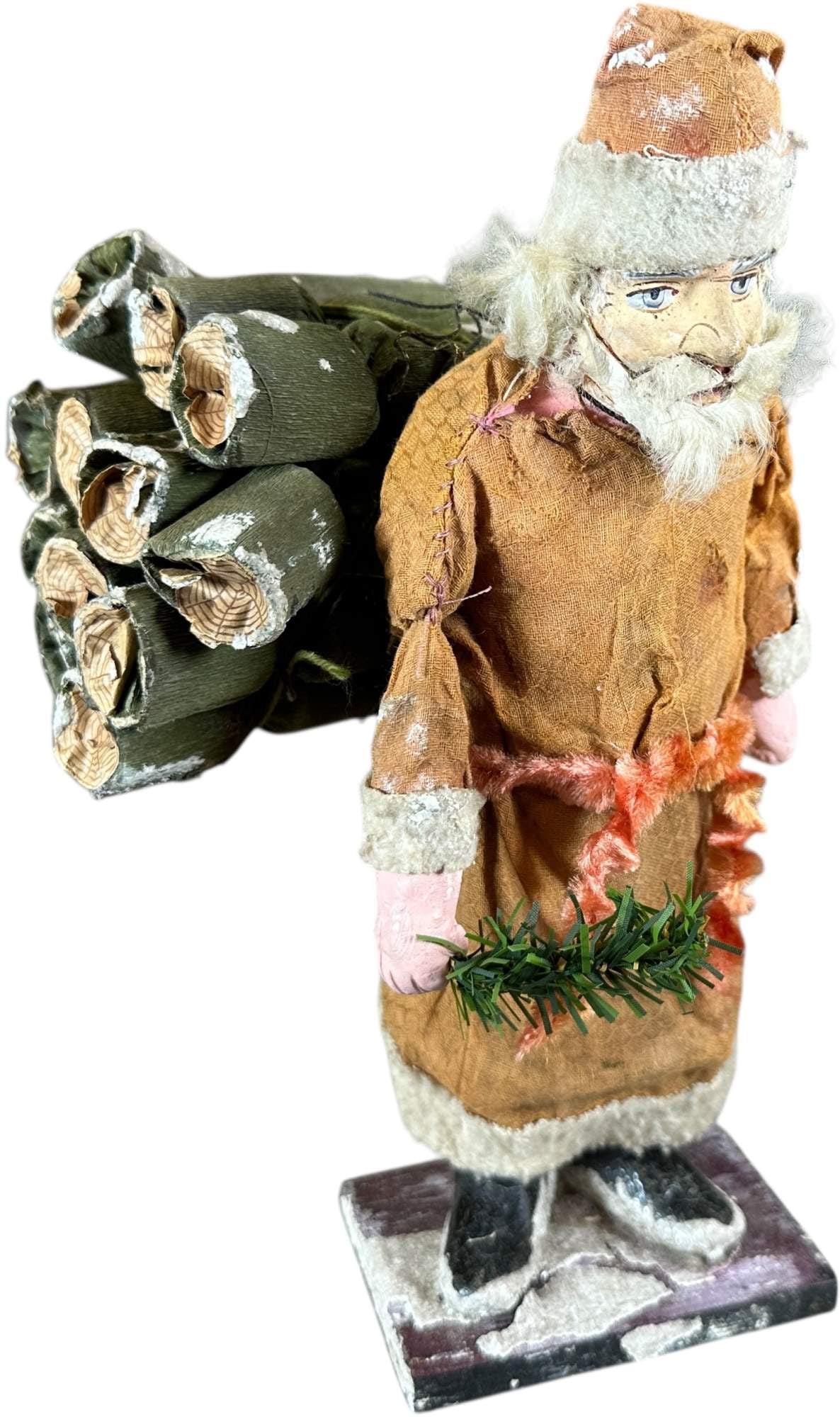 SANTA W/ LOG BACKPACK: 155. SANTA W/ LOG BACKPACK | Logs on back are crackers. | 10.5" h. | Original clothing and face, replaced hands, container glued shut, (Very Good Condition) | $600 - $1,000