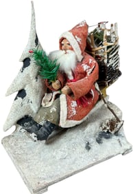 SANTA SLEDDING ON MOUNTAINSIDE