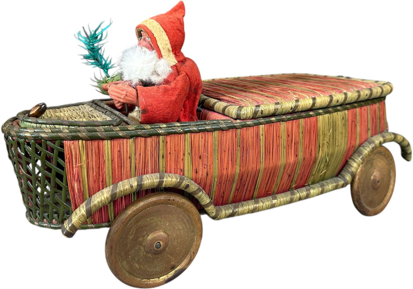 SANTA DRIVING CAR W/ LARGE CONTAINER: 219. SANTA DRIVING CAR W/ LARGE CONTAINER | Interesting piece with colorful wicker body. | 19" l. | (Excellent Condition) | $1,800 - $2,600