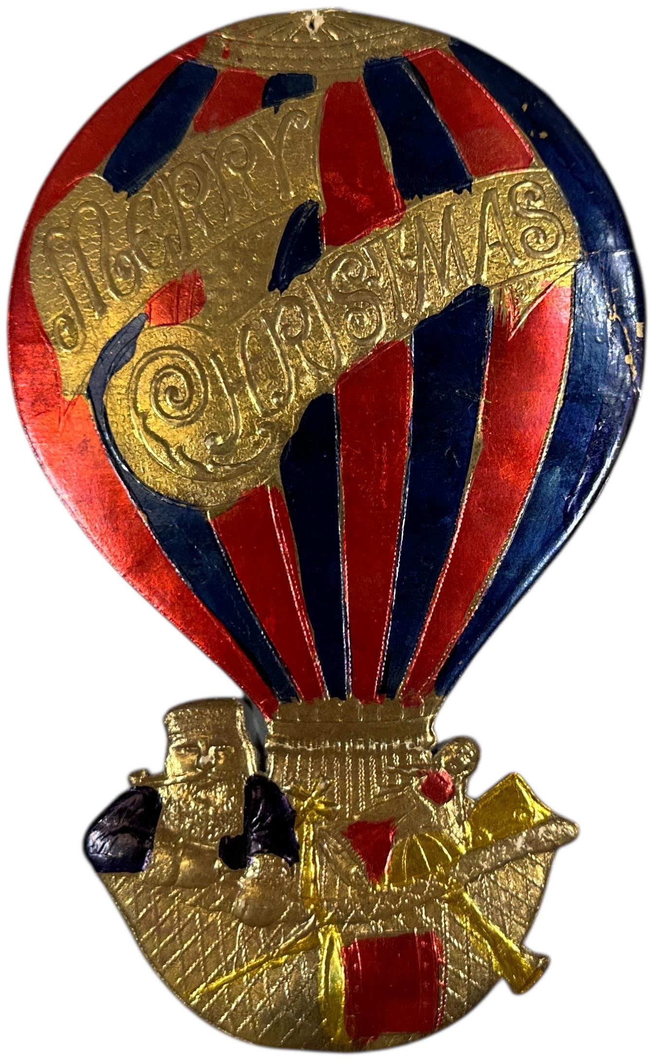 LARGE DRESDEN SANTA IN AIRSHIP ORNAMENT: 244. LARGE DRESDEN SANTA IN AIRSHIP ORNAMENT | Provenance: Linda Morrow Collection | 7" h. | (Excellent Condition) | $600 - $1,000