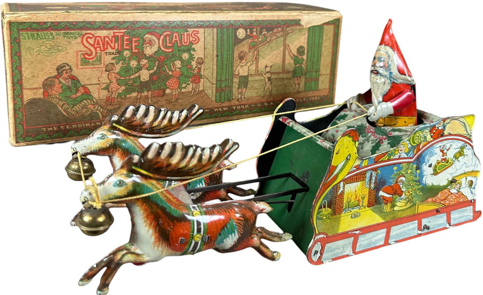 BOXED STRAUSS SANTEE CLAUS SLEIGH: 245. BOXED STRAUSS SANTEE CLAUS SLEIGH | Excellent condition of the toy. | 10.5" l. | Box has expected tears and creases (Very Good to Excellent Condition, toy in (Excellent to Pristine Condition) |