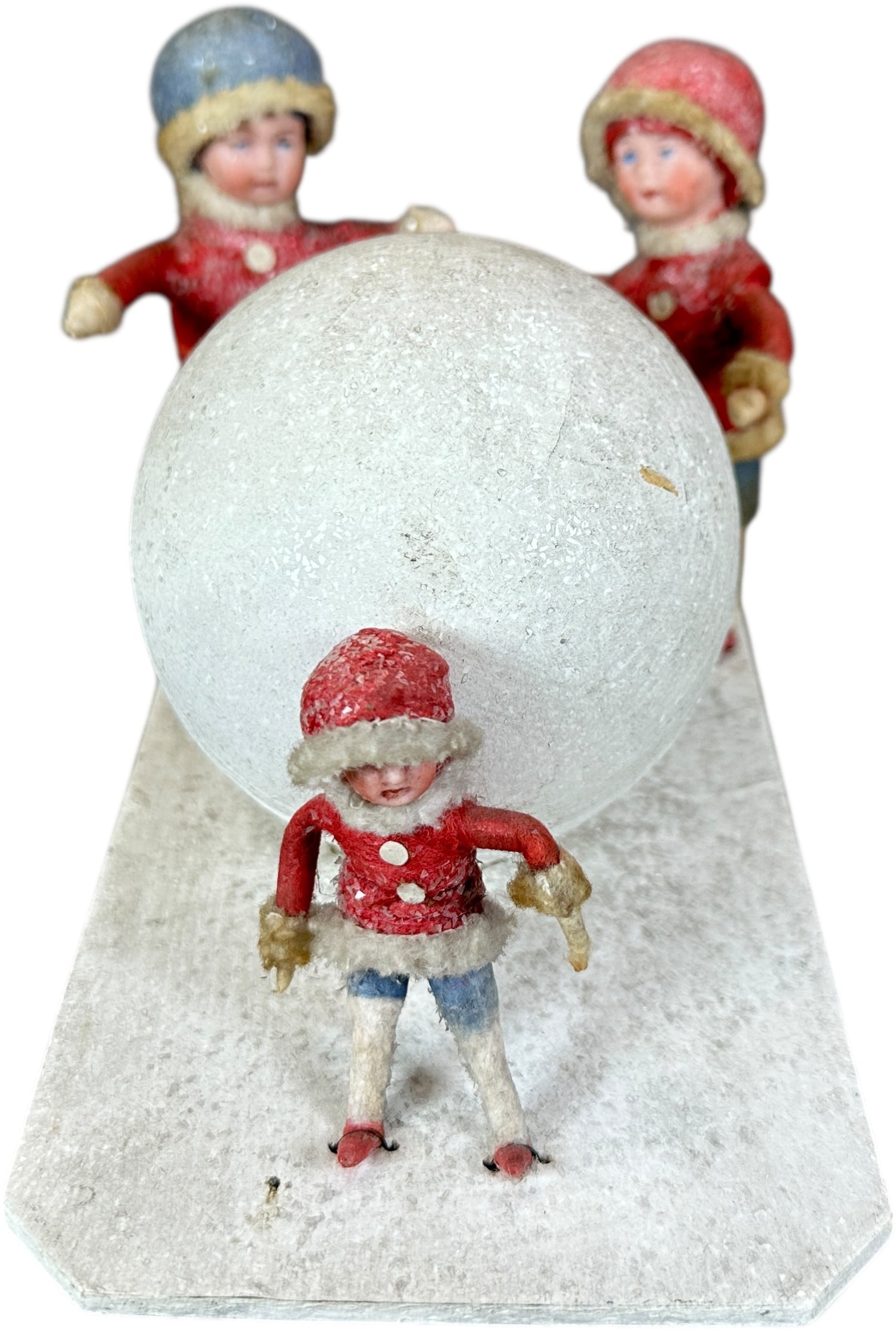 HEUBACH KIDS W/ SNOWBALL CANDY CONTAINER: 259. HEUBACH KIDS W/ SNOWBALL CANDY CONTAINER | Three Heubach head children on a snowy platform. Provenance: Bob & Maurine Young | 6.5" l. | (Pristine Condition) | $800 - $1,200