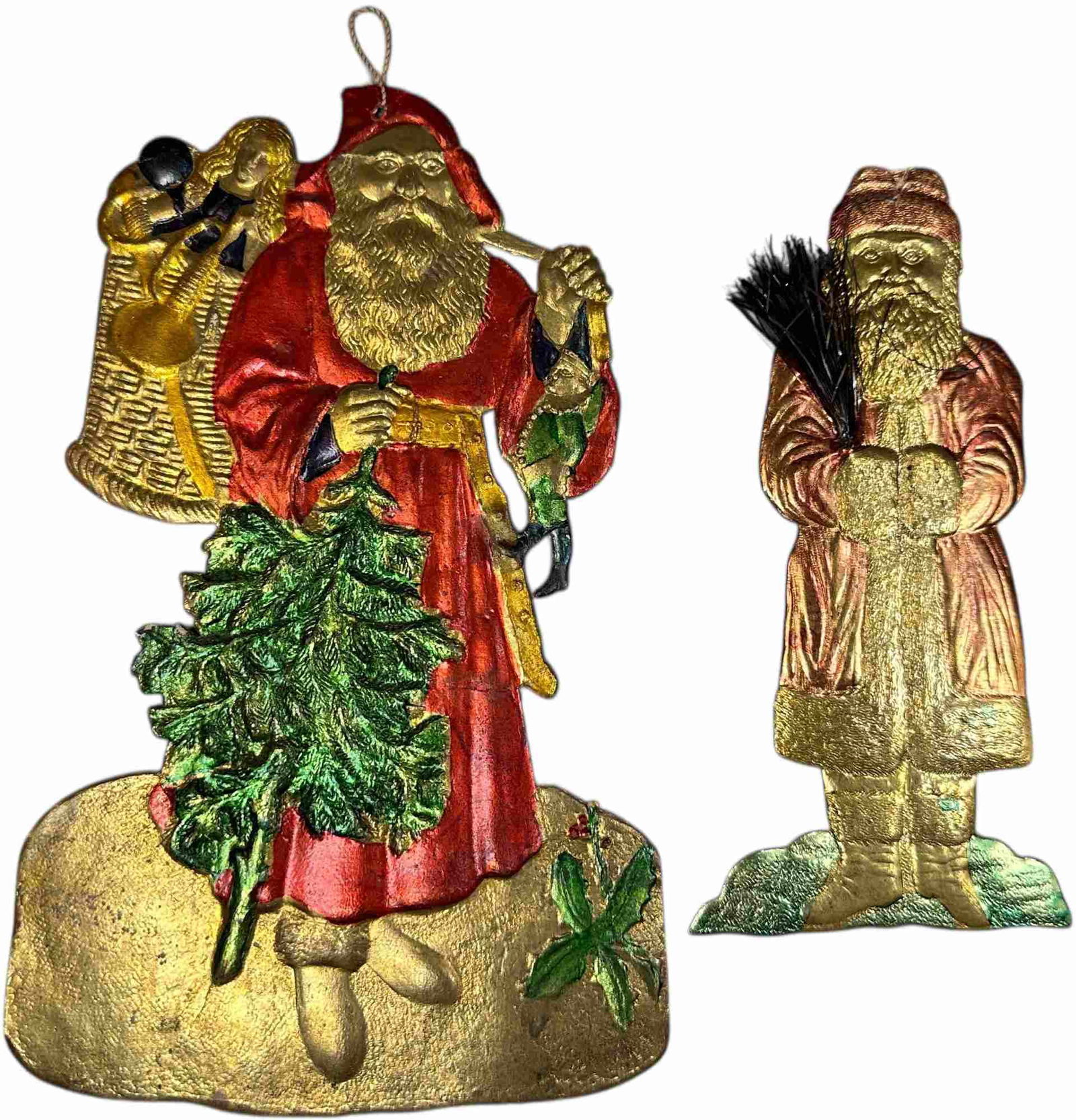 TWO DRESDEN SANTA FLAT ORNAMENTS: 269. TWO DRESDEN SANTA FLAT ORNAMENTS | Small one has tear at top of head. | 9" h. | (Excellent Condition) | $300 - $500