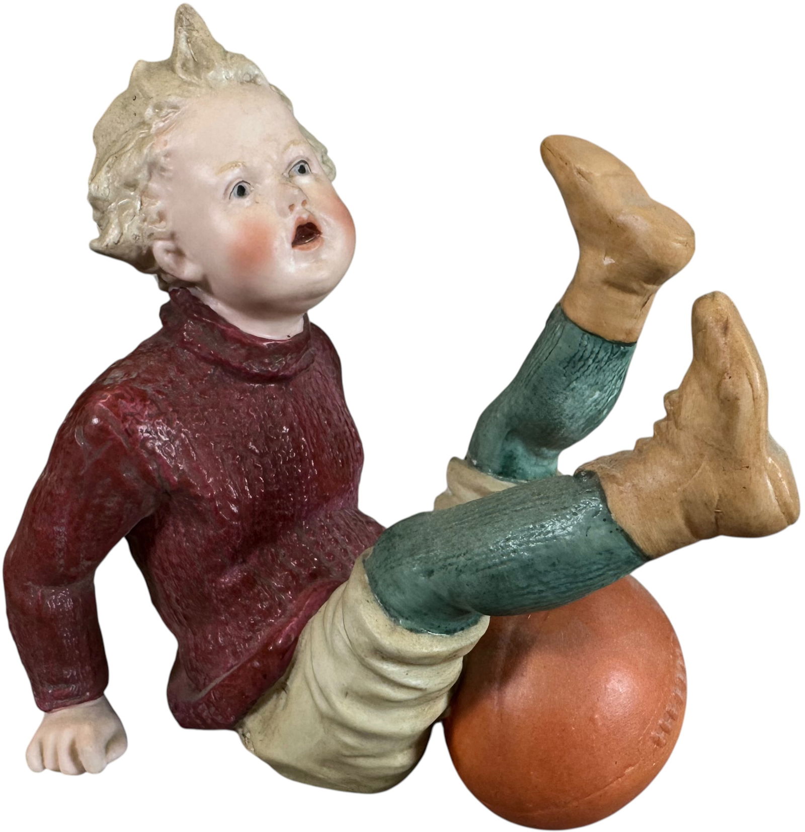 HEUBACH FALLEN BOY W/ RUGBY BALL FIGURINE: 287. HEUBACH FALLEN BOY W/ RUGBY BALL FIGURINE | Germany, such sports theme figures are not often seen. | 5" l. | (Pristine Condition) | $400 - $800