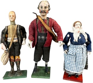 THREE WOODEN PEASANT FIGURES