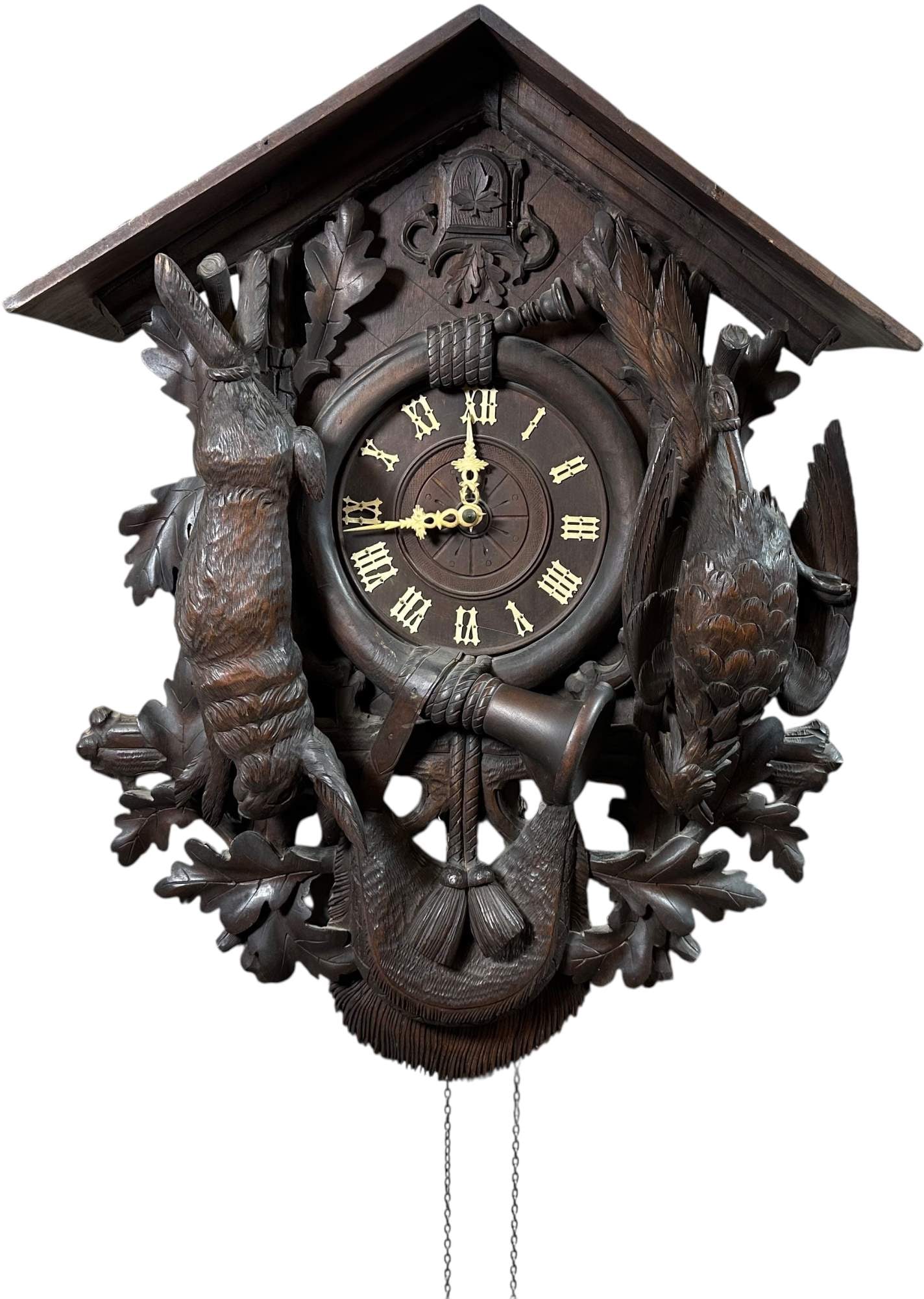 BLACK FOREST CARVED CUCKOO HUNTING LODGE CLOCK: 305. BLACK FOREST CARVED CUCKOO HUNTING LODGE CLOCK | Provenance: David Bausch Collection. | 29" h. | (Excellent Condition) | $500 - $1,000