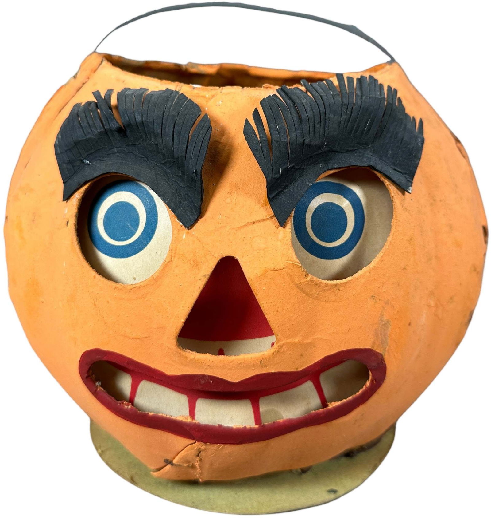 LARGE JACK O LANTERN W/ HAIRY EYEBROWS: 328. LARGE JACK O LANTERN W/ HAIRY EYEBROWS | Early German Halloween. Provenance: Linda Morrow Collection | 7" h. | Paper inserts are likely added, otherwise (Excellent Condition) | $400 - $800