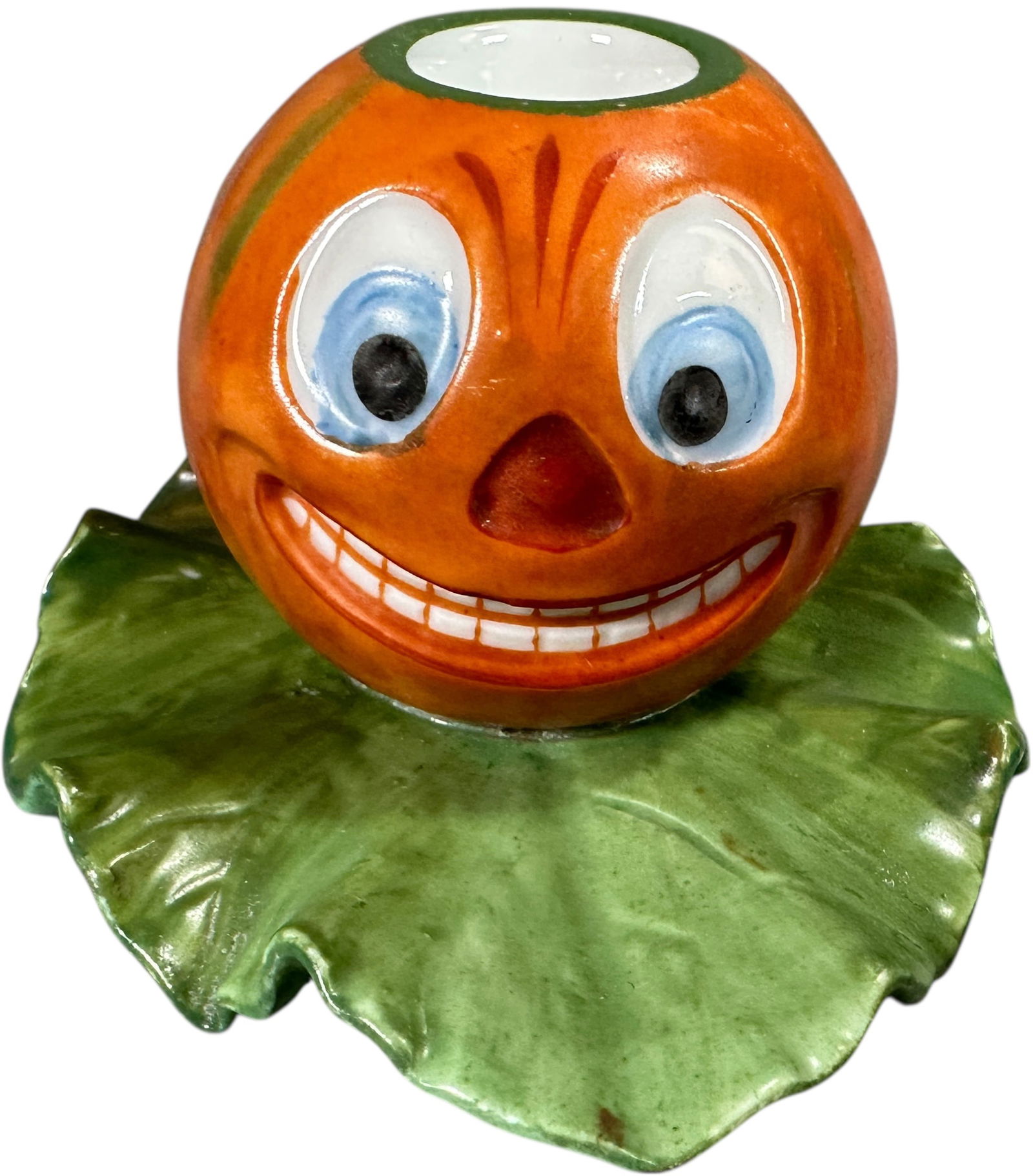 MEDIUM GERMAN PUMPKIN CANDLE STICK HOLDER: 337. MEDIUM GERMAN PUMPKIN CANDLE STICK HOLDER | Provenance: Linda Morrow Collection | 4.25" l. leaf | (Pristine Condition) | $700 - $1,400