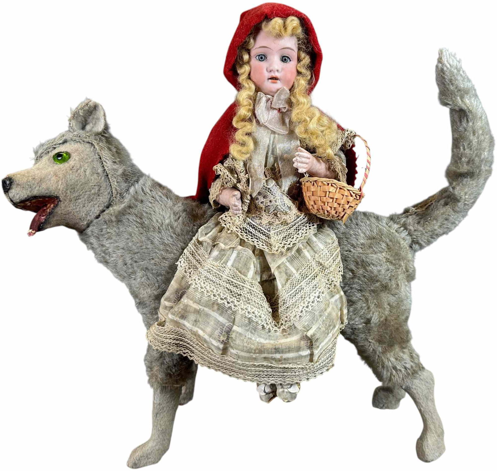 LARGE RED RIDING HOOD ON WOLF CANDY CONTAINER: 348. LARGE RED RIDING HOOD ON WOLF CANDY CONTAINER | Provenance: Ed & Brenda DeGarbolewski Collection. | 15" h. | Large impressive figure wolf is missing some teeth, (Excellent Condition) | $1,600 -
