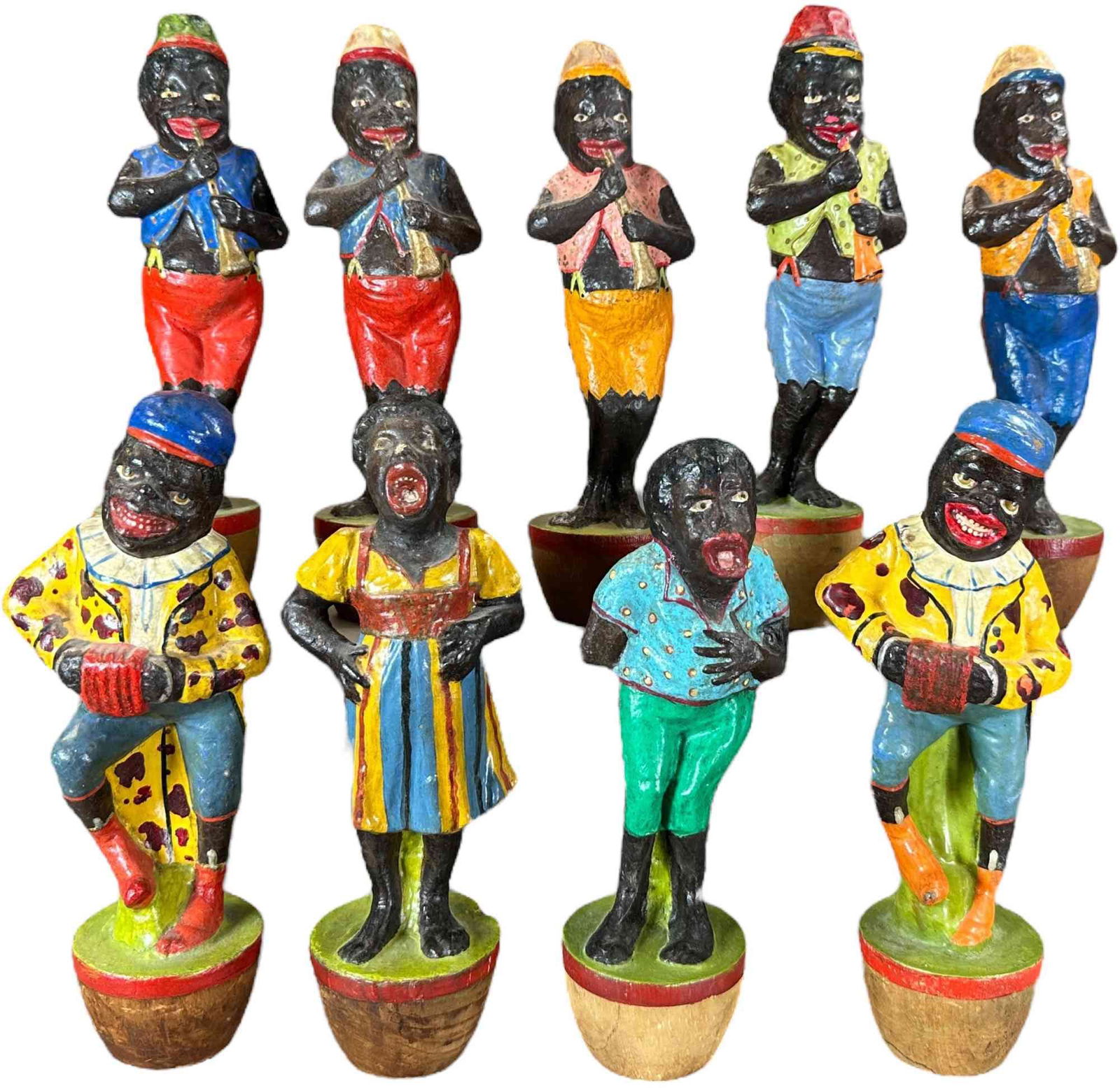 MINSTREL BAND FIGURE NINE PINS SKITTLE: 364. MINSTREL BAND FIGURE NINE PINS SKITTLE | Germany, painted composition on wood, these are nice for such an early set. Provenance: Beth Karp Collection. | 8.5" h. | Some very minimal cracking,