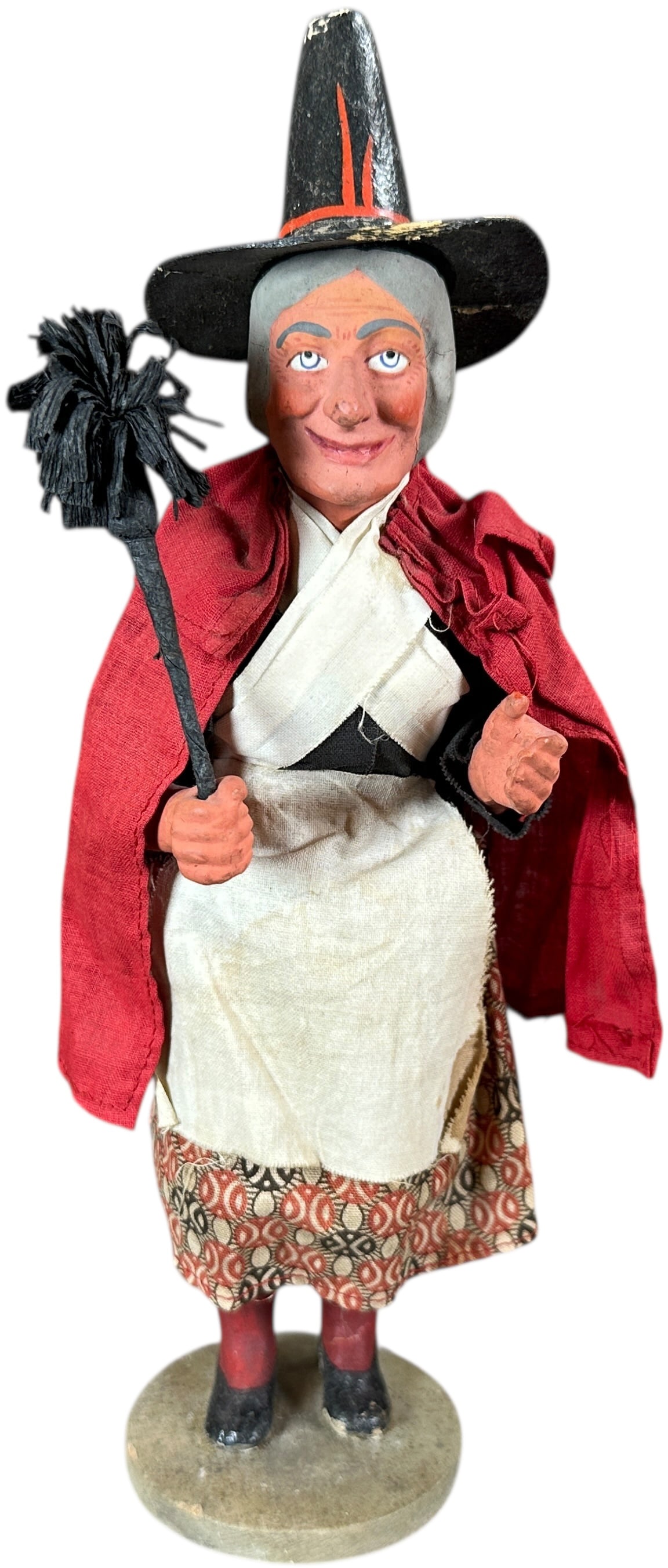 GERMAN WITCH CANDY CONTAINER: 370. GERMAN WITCH CANDY CONTAINER | Nice original figure. Clothes are in fantastic condition. | 10.5" h. | Small crack on one foot, candy tubes are old and right, small stain on apron, overall in (Exc