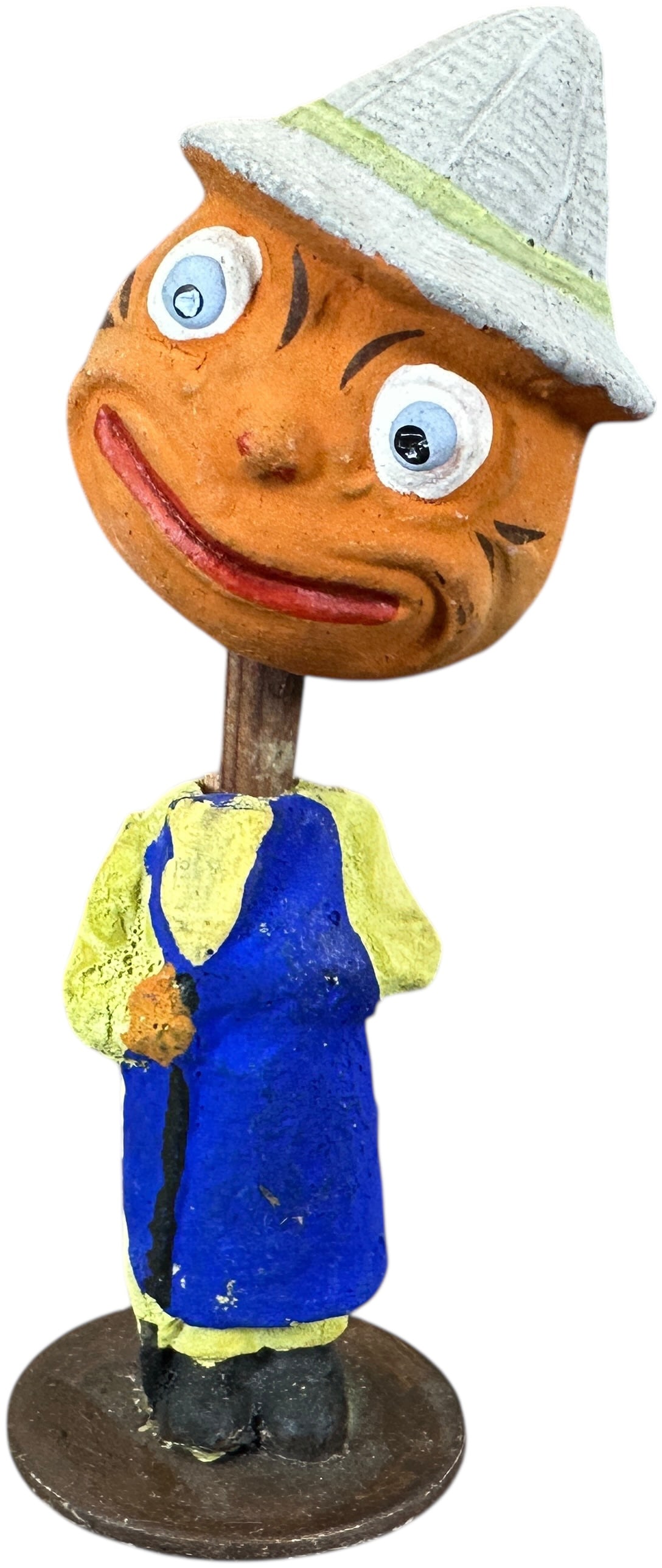 HALLOWEEN PUMPKIN HEAD MAN NODDER: 385. HALLOWEEN PUMPKIN HEAD MAN NODDER | Dressed with blue apron, one black eye is missing. | 6" h. | (Excellent Condition) | $400 - $700