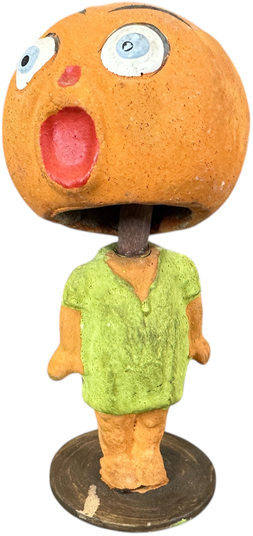 HALLOWEEN PUMPKIN HEAD GIRL NODDER: 386. HALLOWEEN PUMPKIN HEAD GIRL NODDER | Spring is tangled in head, cardboard base is marked Germany. | 6.5" h. | (Excellent Condition) | $400 - $700