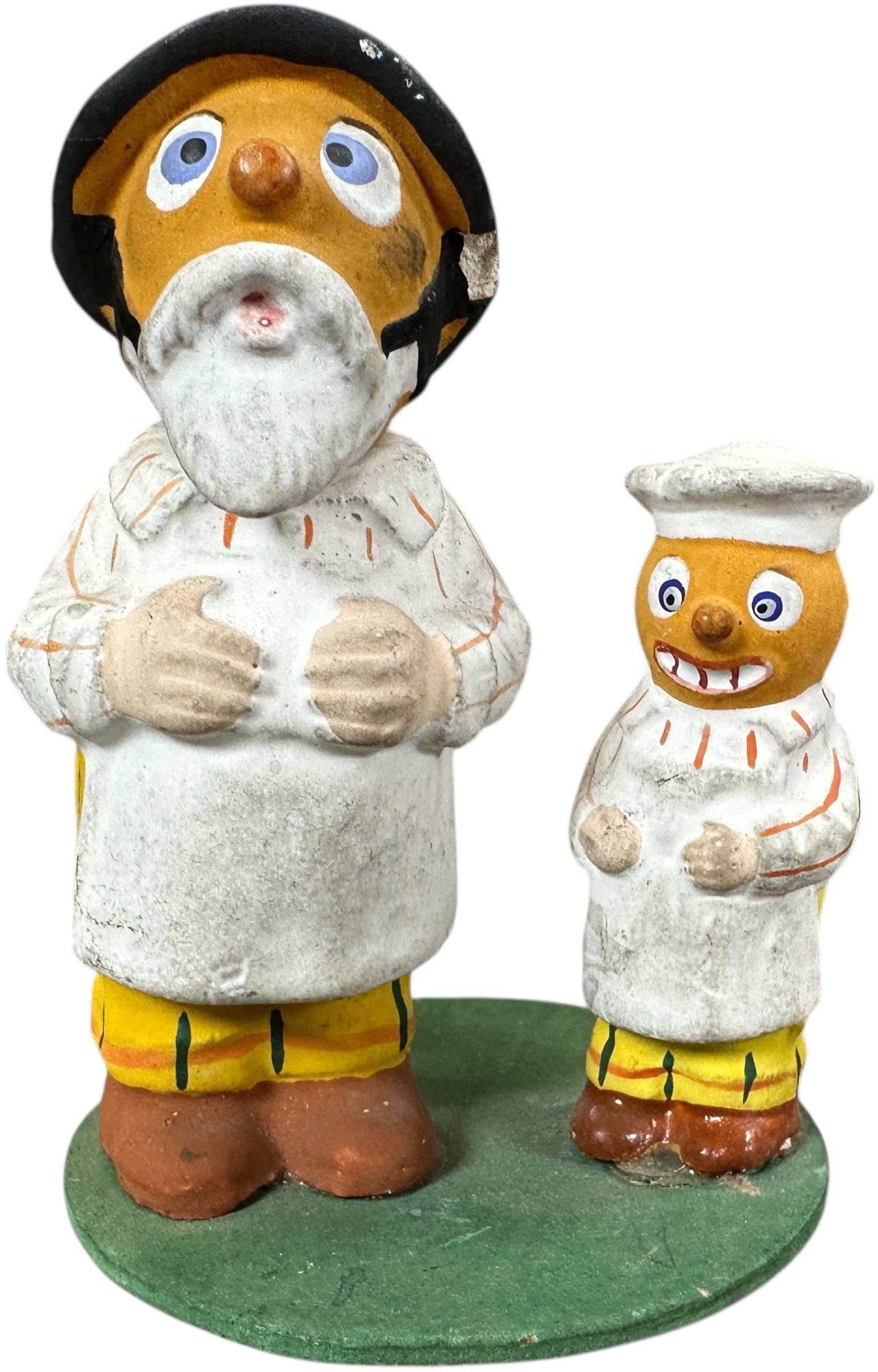 PUMPKIN FATHER SON BAKER DUO CANDY CONTAINER: 387. PUMPKIN FATHER SON BAKER DUO CANDY CONTAINER | Early German Halloween. Father is a candy container. Provenance: Linda Morrow Collection | 3.5" h. | (Excellent to Pristine Condition) | $600 - $1,2