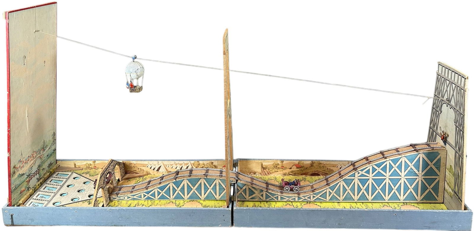 LARGE FRENCH HOT AIR BALLOON MARBLE GAME: 399. LARGE FRENCH HOT AIR BALLOON MARBLE GAME | A chain reaction game, played by releasing the gondola causing it to trigger the clown to release a minecart which travels down the track and knocks ove